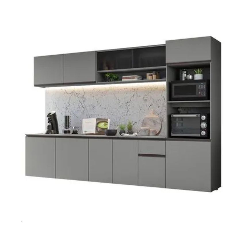 Modern kitchen unit with grey cabinets, built-in microwave and oven, and marble backsplash.